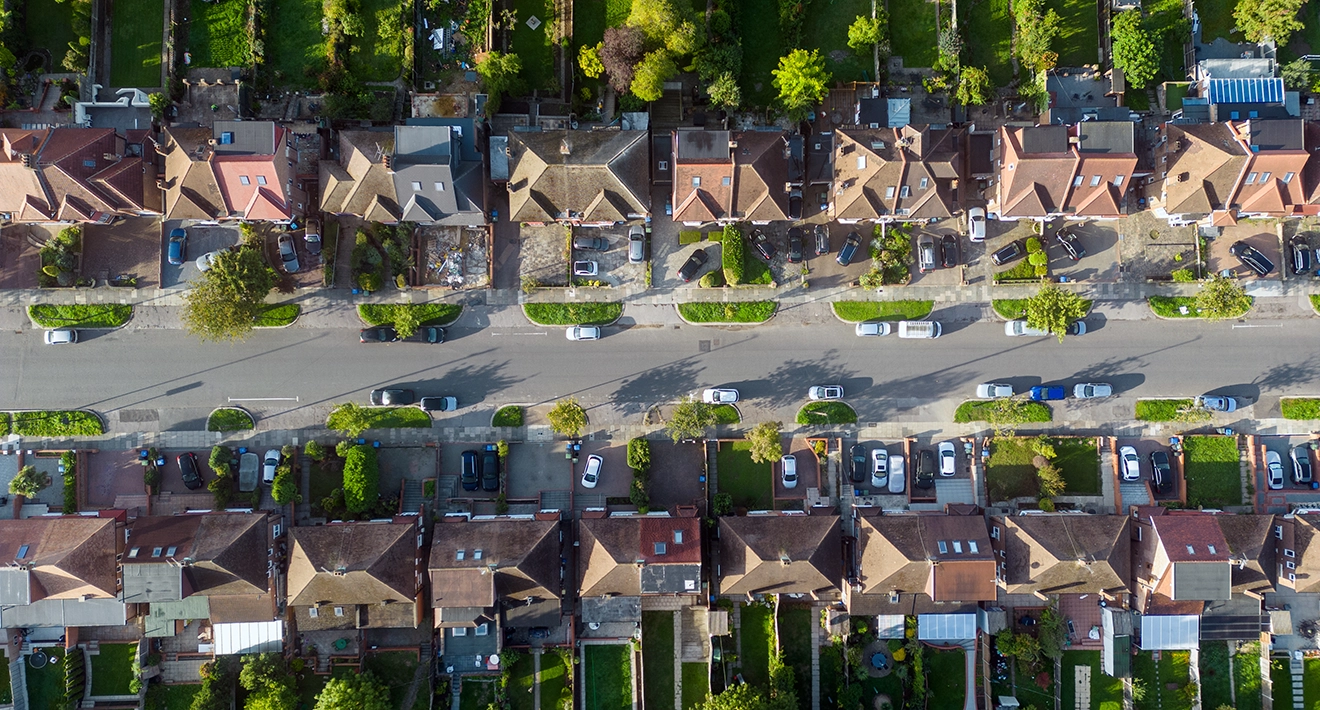 An aerial view of a residential street at sunrise