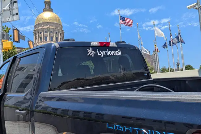 A truck with a Lynkwell decal on the back window