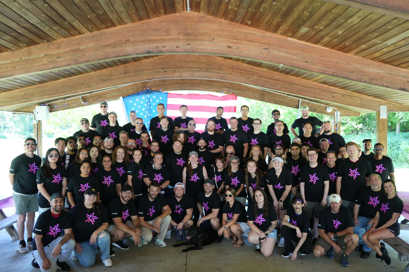 The Lynkwell team posing under an American flag in a gazebo